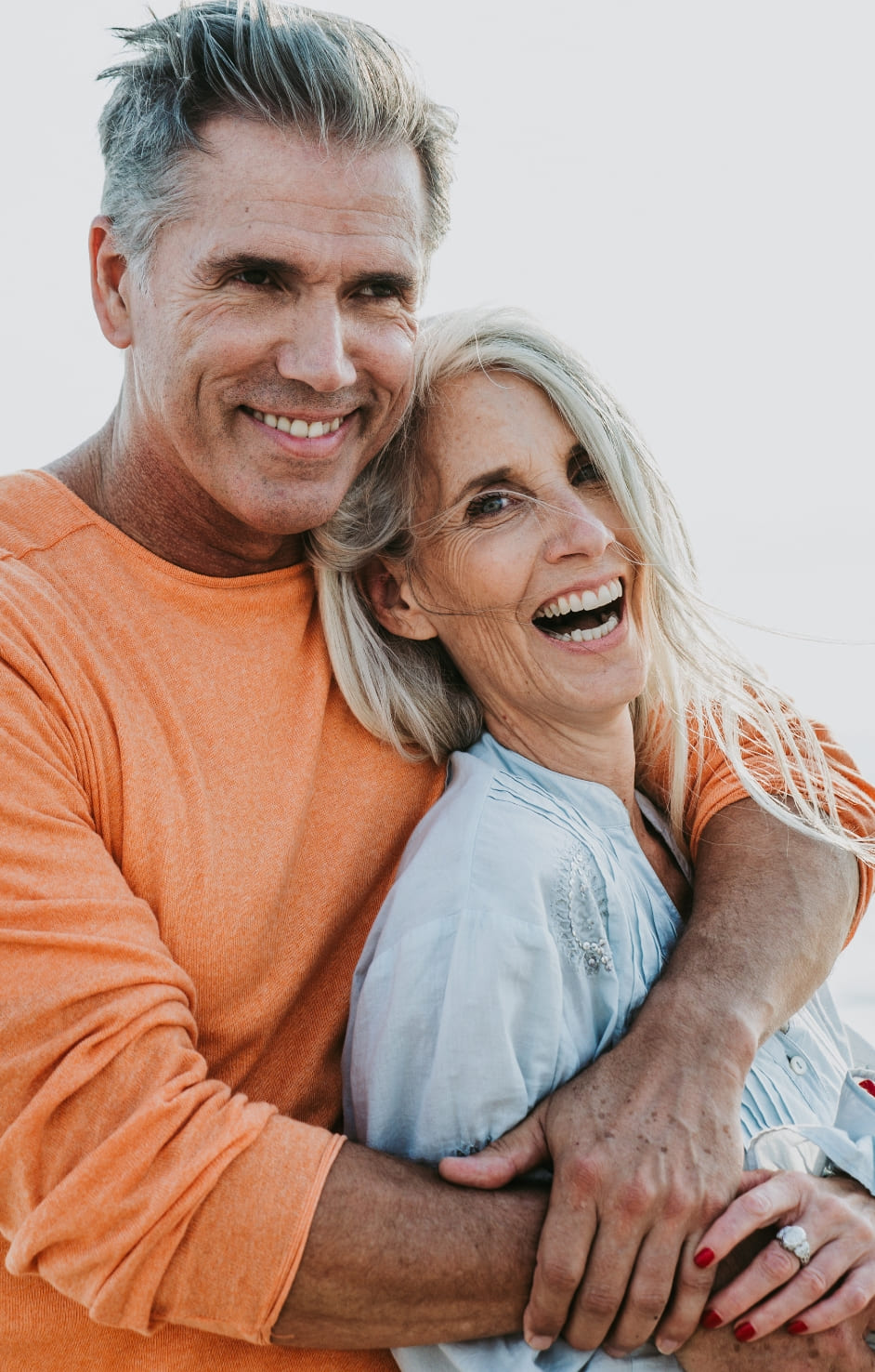 happy senior couple spending time at the beach